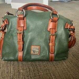 Dooney & Bourke's satchels, the Bristol is crafted of rich, pebbled leather.